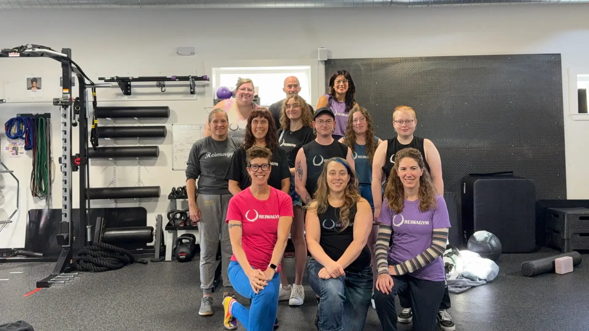 Reimagym fitness team posing together inside the gym