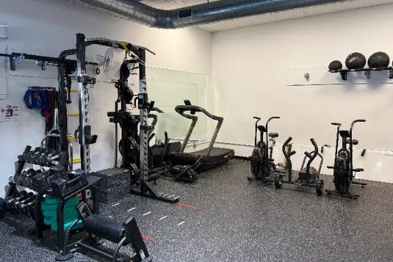 Reimagym workout space with machines and free weights